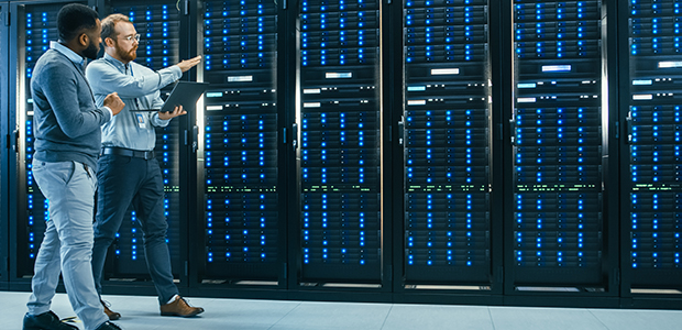 Technician and engineer walking in data center