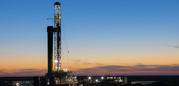 Permian drilling rig at sunset