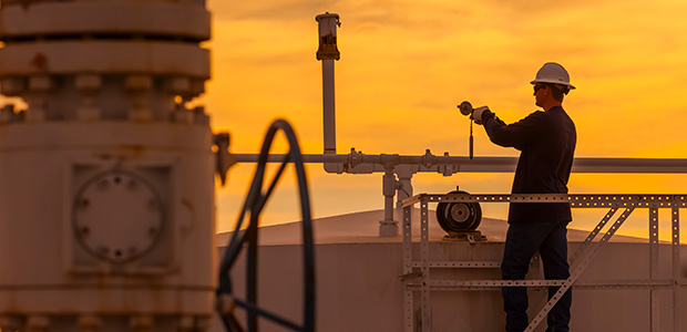 man on pipeline at sunset